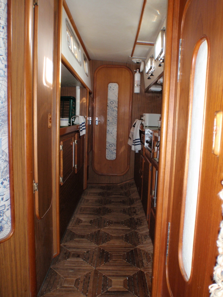 The galley. The wooden floor tiles went, too many gaps for things to fall into. I eventually painted the kitchen a much light colour